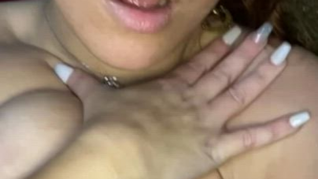 Licking and rubbing cum all over her big tits