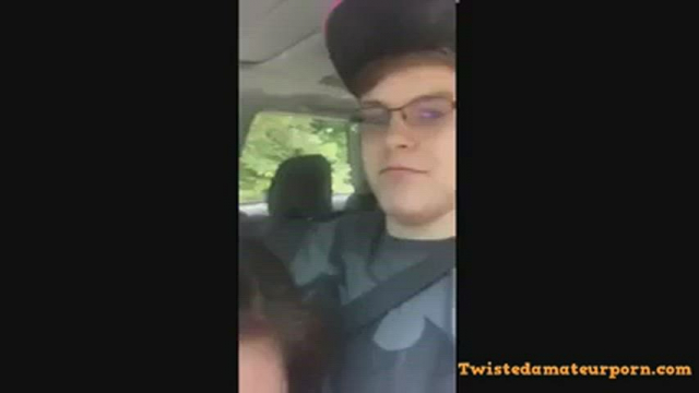Asian lady sucks of her partner while her roommate sits in the back of the car