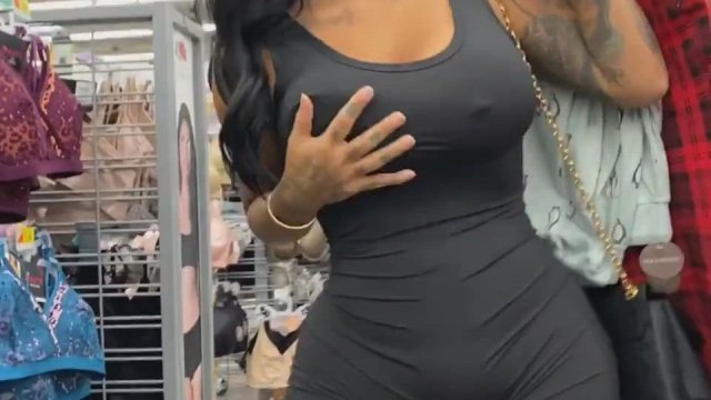 Flashing her huge tits in clothing store