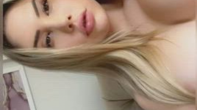 stacked blonde playing with toy