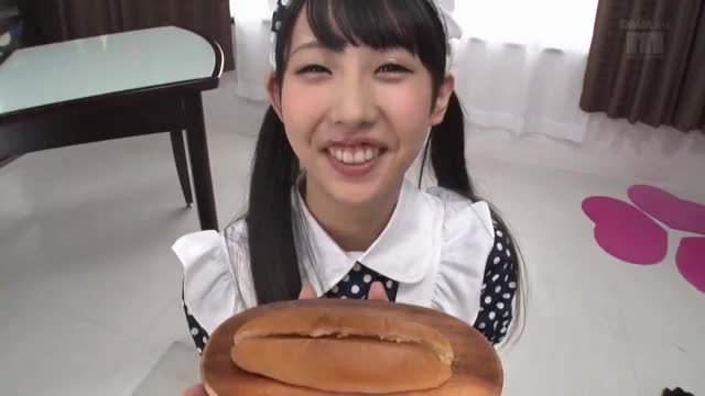 Cute Asian eats a hotdog